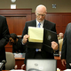 Defense attorneys Mark O'Mara (left) and Don West with George Zimmerman at the July 3 proceedings (pool/Getty Images)